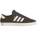 Adidas Skateboarding Puig indoor skate shoes in shadow olive and off white with durable design and skate-ready features.