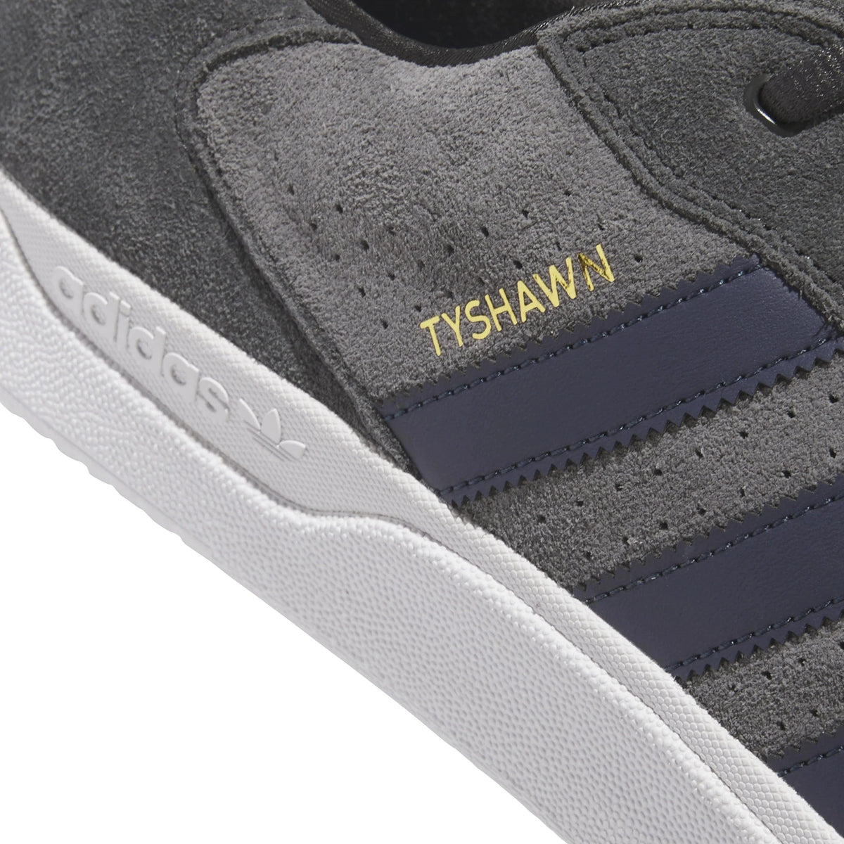 Adidas Skateboarding Tyshawn Low Pro skate shoes in carbon grey and grey five, featuring a sleek low-profile design and skate-ready style.