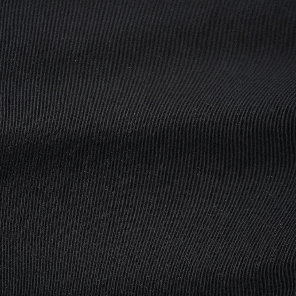 Black Butter Goods Climber Shorts laid flat, showcasing their relaxed fit and durable fabric suitable for casual wear.