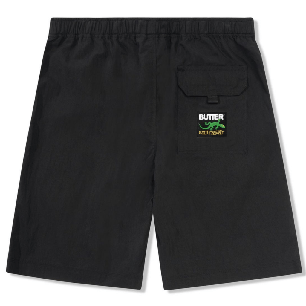 Black Butter Goods Climber Shorts laid flat, showcasing their relaxed fit and durable fabric for casual and skateboarding wear.