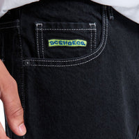 Black DC Baggy Denim Jeans with relaxed fit and classic five-pocket design, styled on a model.