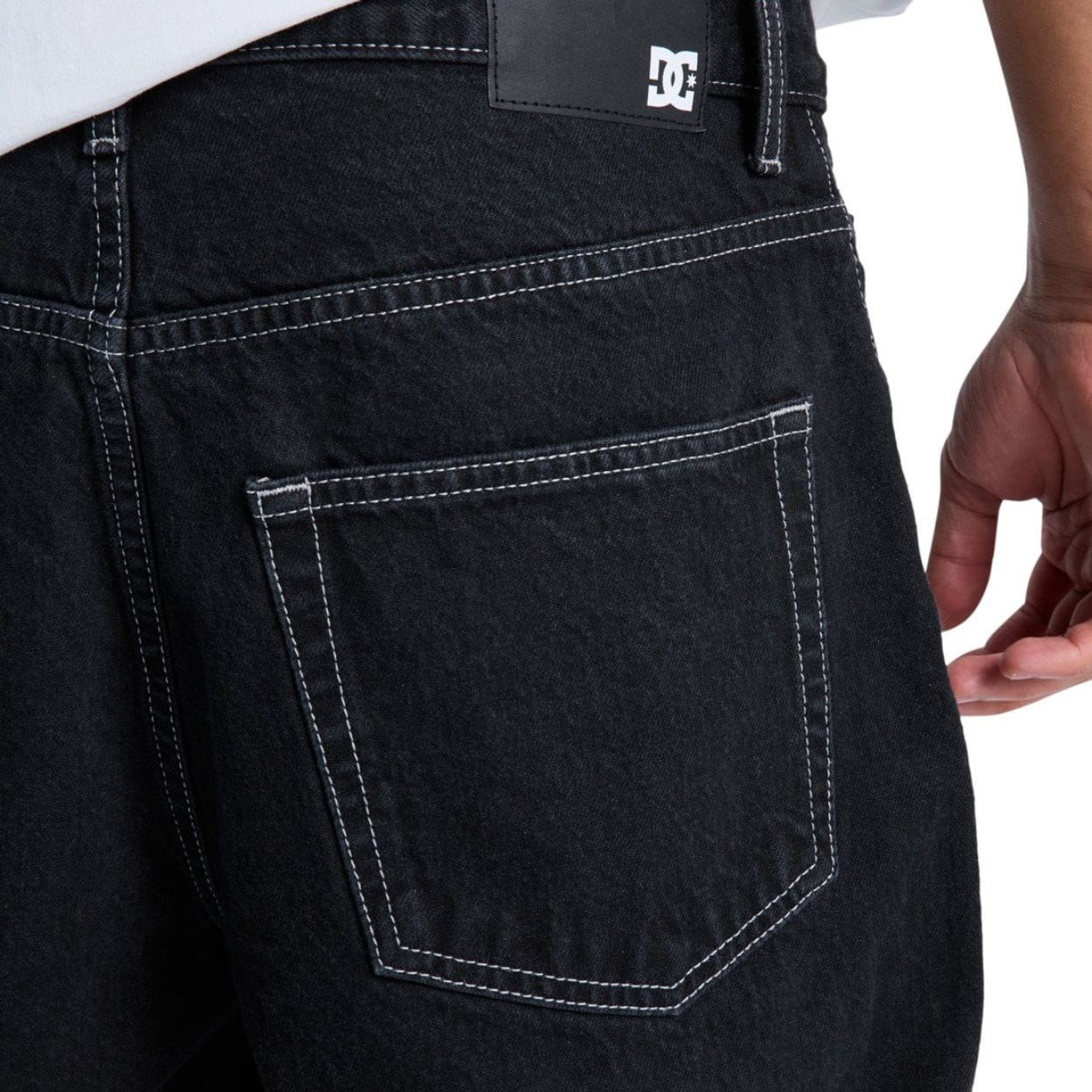 Black DC Shoes Baggy Denim Jeans with relaxed fit, classic five-pocket design, and distressed details.
