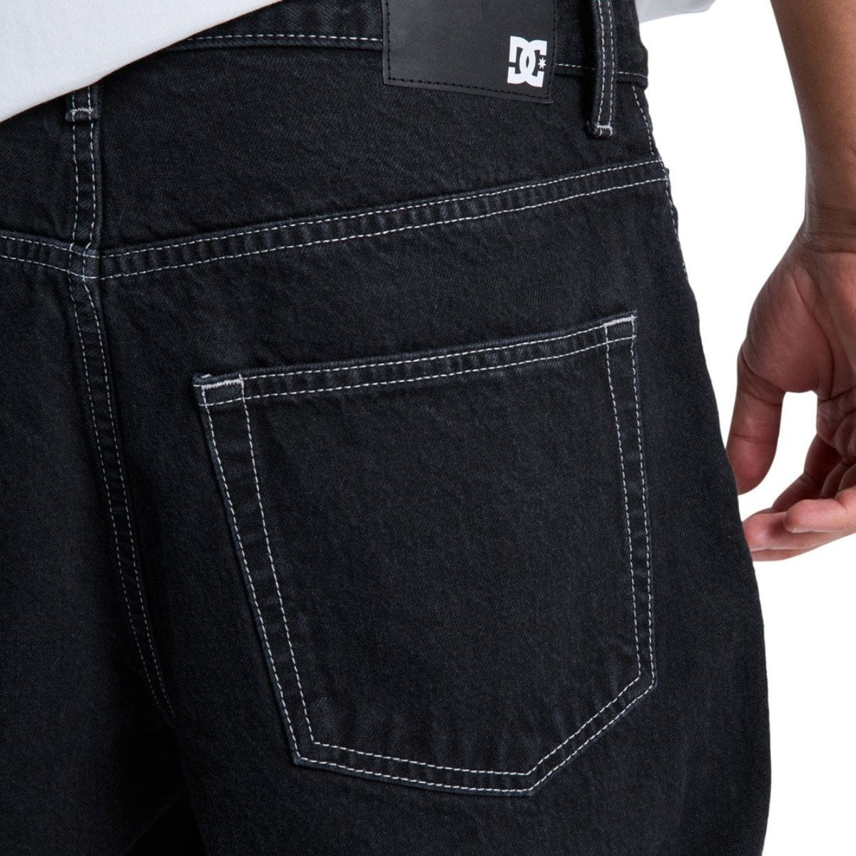 Black DC Shoes Baggy Denim Jeans with relaxed fit, classic five-pocket design, and distressed details.