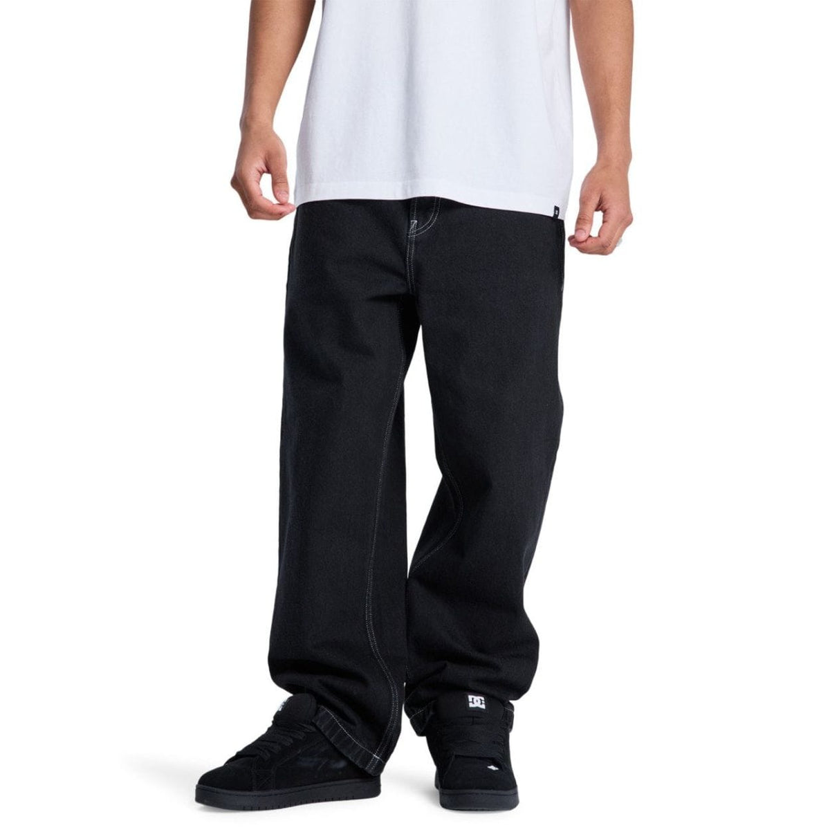 Black DC Baggy Denim Jeans displayed on a model, showcasing relaxed fit and classic denim style from DC Shoes.