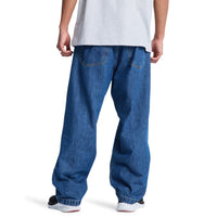 Blue DC Shoes Baggy Denim Jeans with relaxed fit and classic five-pocket design displayed on a flat surface.