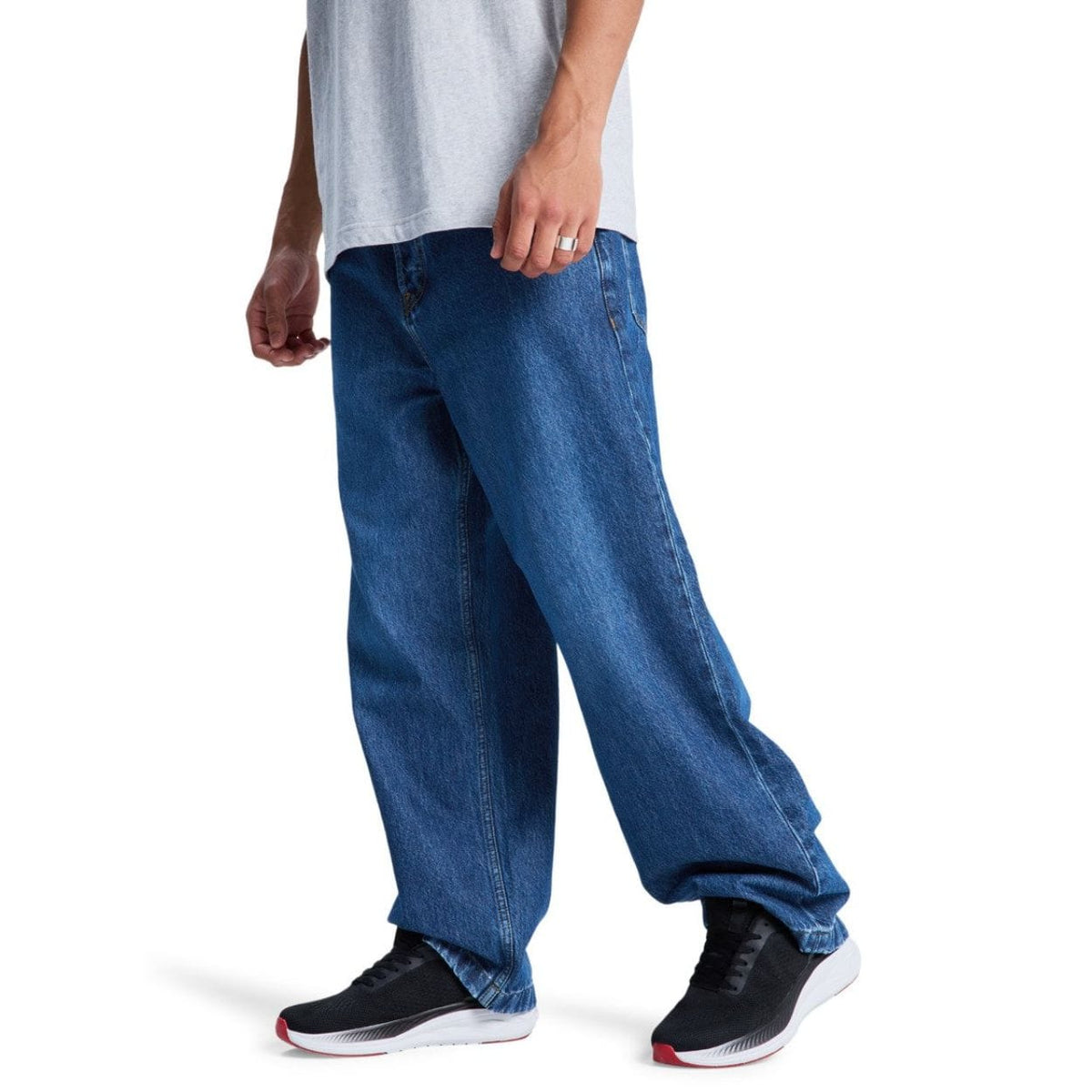 Blue DC Shoes Baggy Denim Jeans with relaxed fit, classic five-pocket style, and branded stitching.