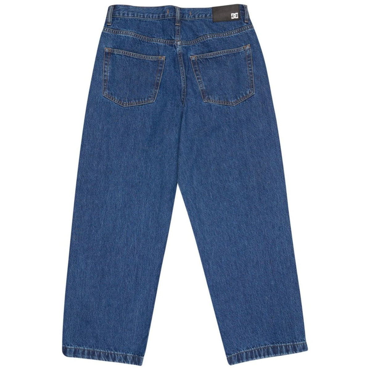 Blue DC Baggy Denim Jeans displayed on a model, showcasing relaxed fit and classic denim style by DC Shoes.