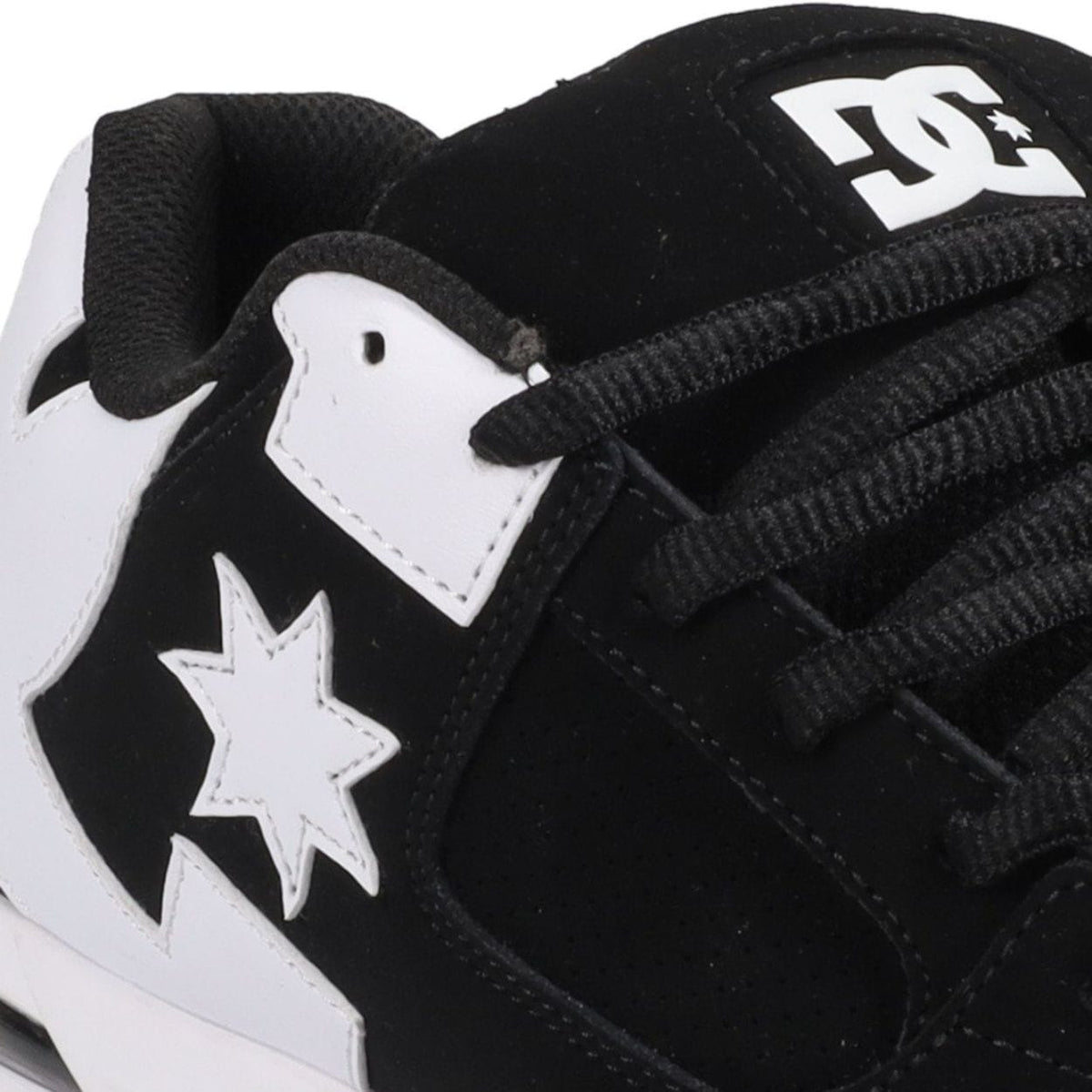 DC Shoes Command skate shoes in black and white, featuring a sleek design, durable skateboarding sole, and classic logo details.