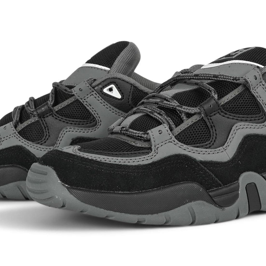DC Shoes Truth skate shoes in black, grey, and blue with durable design and classic skate style.