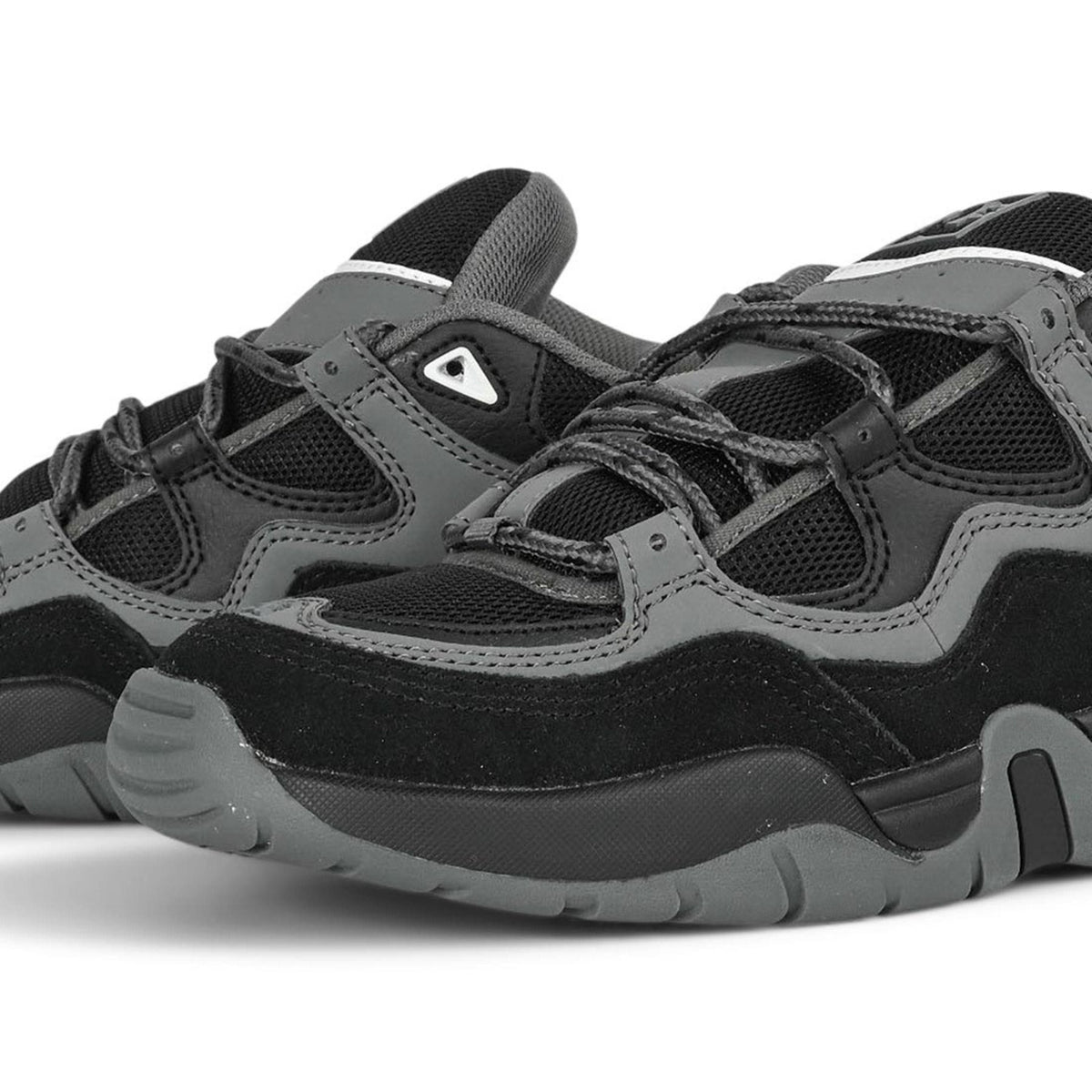 DC Shoes Truth skate shoes in black, grey, and blue with durable design and classic skate style.