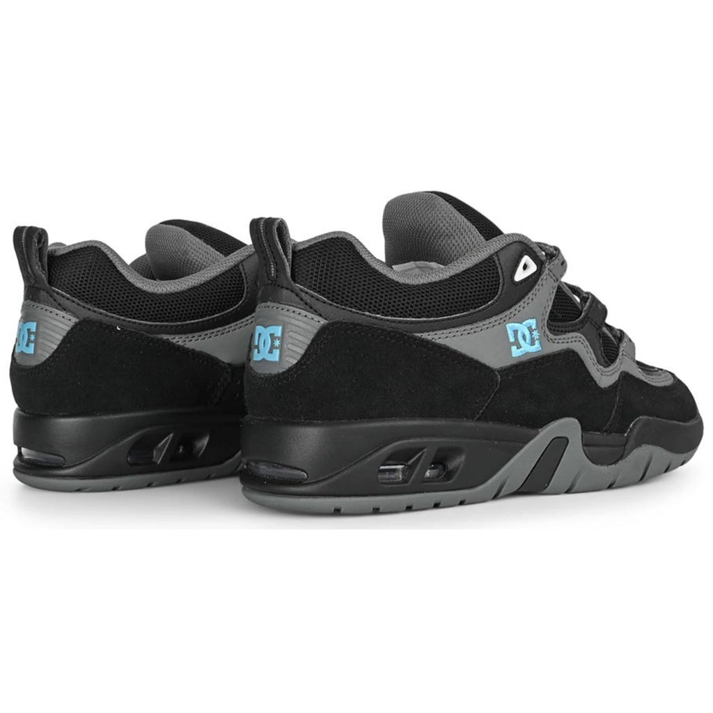 DC Shoes Truth skate shoes in black, grey, and blue with durable design and skate-ready style.