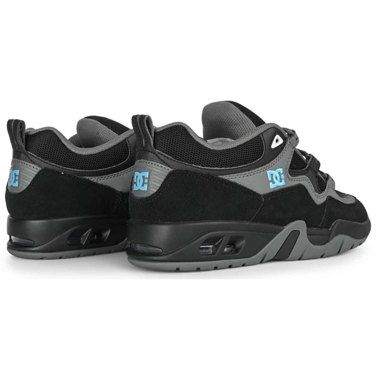 DC Shoes Truth skate shoes in black, grey, and blue with durable design and skate-ready style.