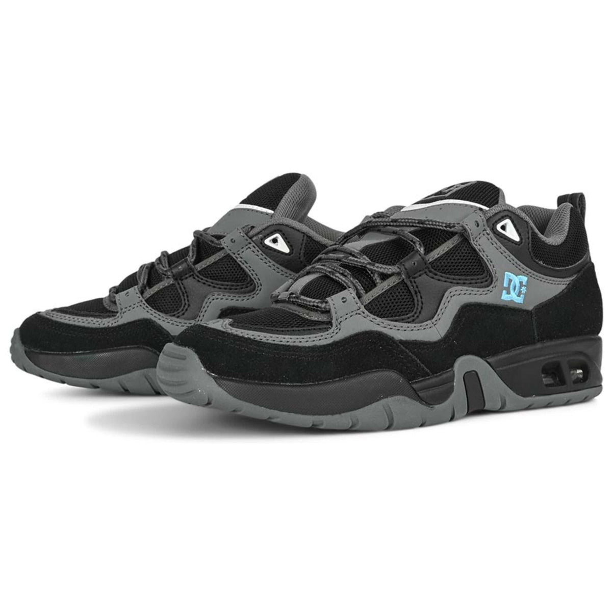 DC Shoes Truth skate shoes in black, grey, and blue with a low-top design and skate-inspired style.