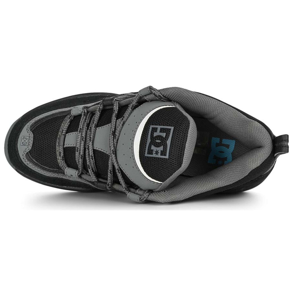 DC Shoes Truth skate shoes in black, grey, and blue with stylish design and durable construction for skateboarding.