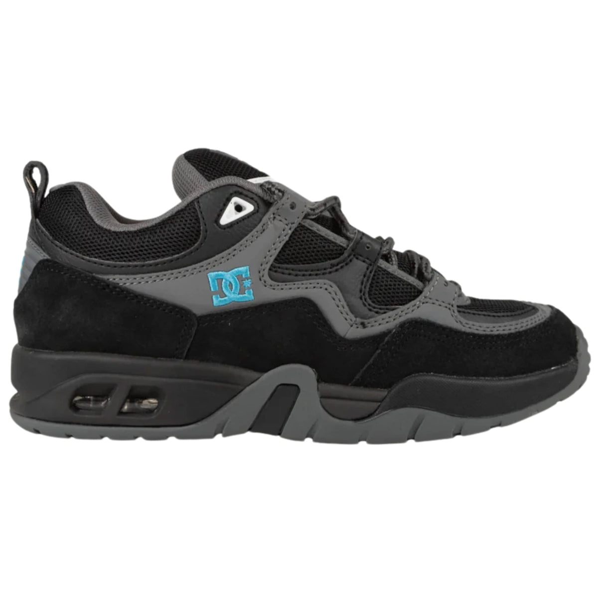 DC Shoes Truth skate shoes in black, grey, and blue with a sleek design, perfect for skateboarding and casual wear.
