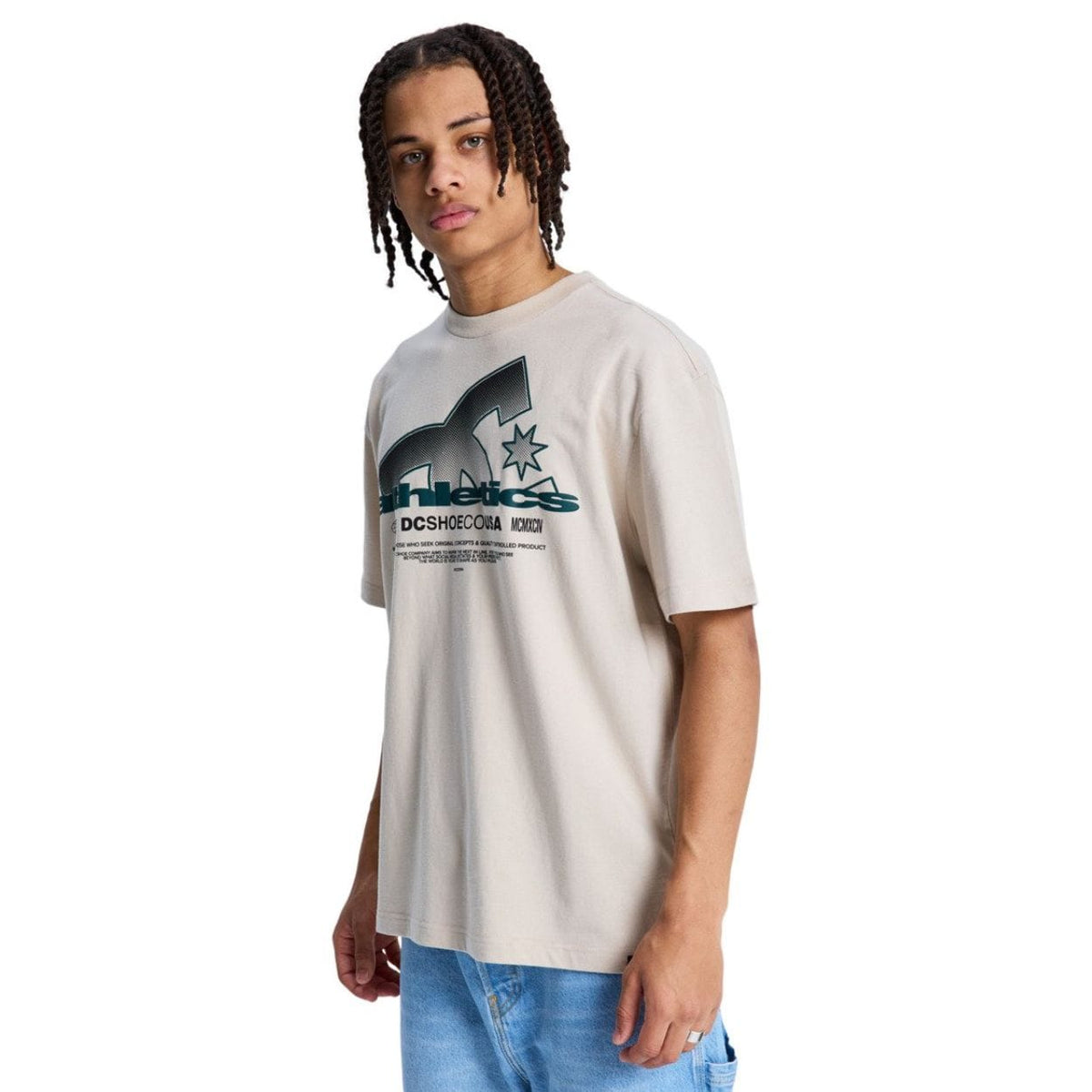Beige DC Slathletic T-Shirt by DC Shoes, casual tee with logo detail, displayed on a model.