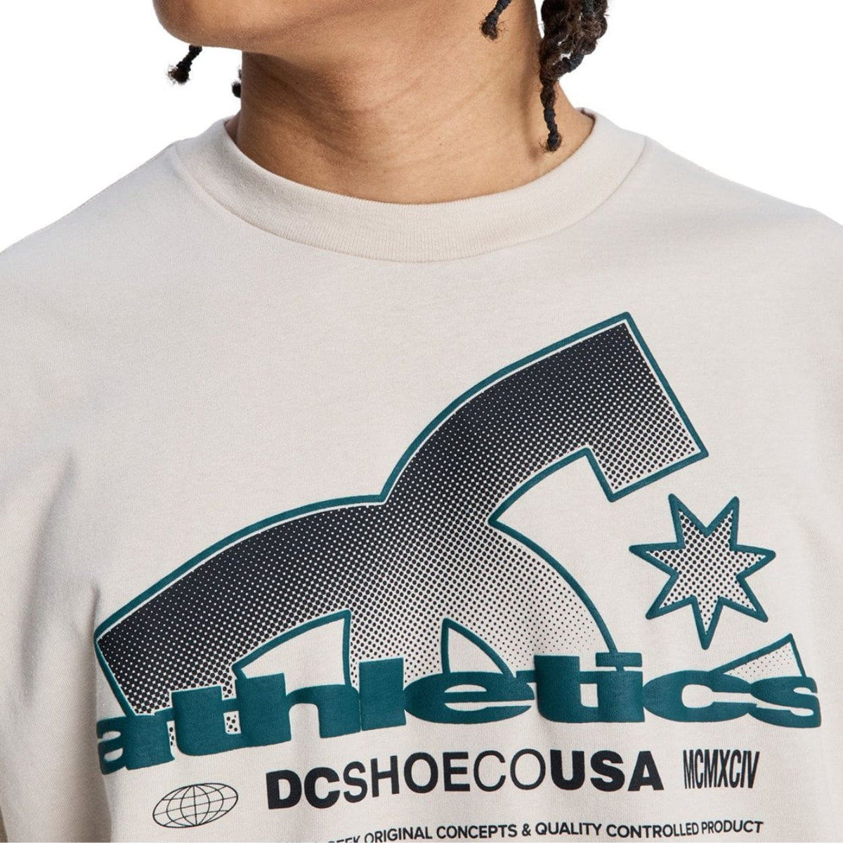 Beige DC Slathletic T-Shirt from DC Shoes, casual men's tee with logo detail, laid flat showing front design and soft fabric texture.