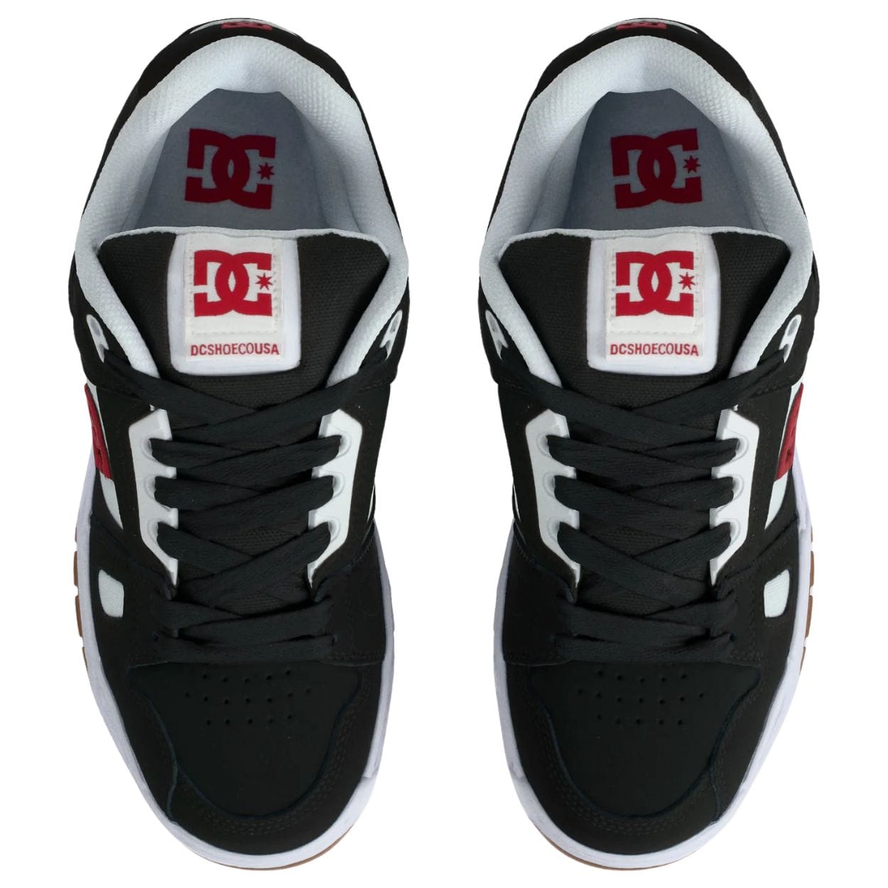 DC Shoes Stag skate shoes in black, white, and red with classic design and skateboarding style.