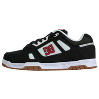 DC Stag skate shoes in black, white, and red with a low-profile design and skate-inspired style, perfect for casual and skateboarding use.