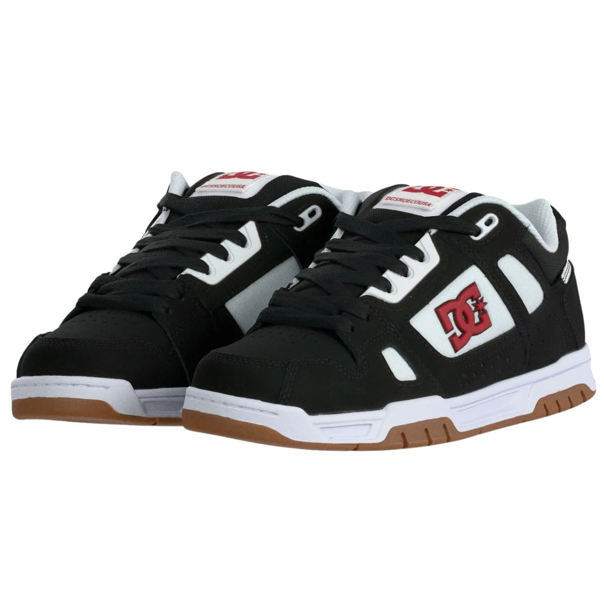 DC Stag skate shoes in black, white, and red with a sleek design, featuring durable materials and skate-ready style.