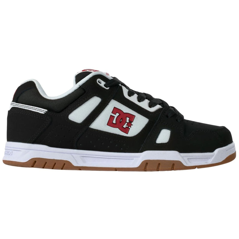 DC Shoes Stag Skate Shoes in black, white, and red with stylish design and skateboarding sole, ideal for skateboarding and casual wear.