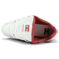 White DC Stag skate shoes with black accents, featuring low-top design, durable sole, and classic DC Shoes branding.