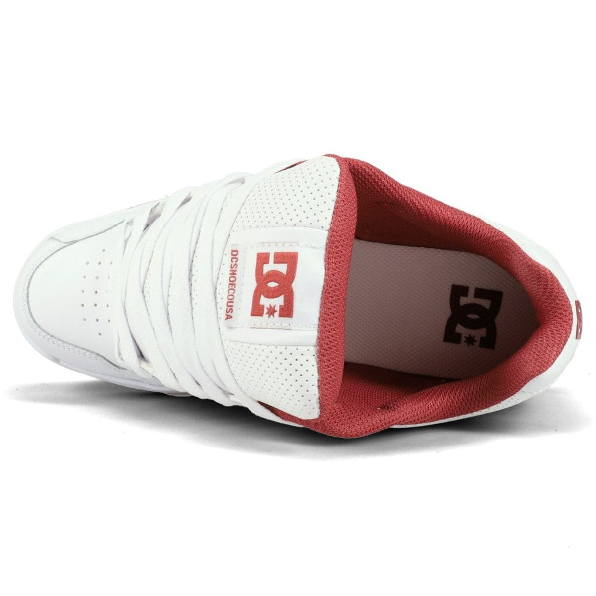 DC Stag skate shoes in white with classic low-top design, featuring skate-inspired details and durable construction from DC Shoes.