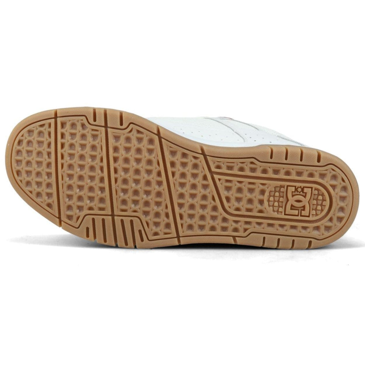 White DC Stag skate shoes with black accents and flat rubber soles, designed for skateboarding and casual wear.