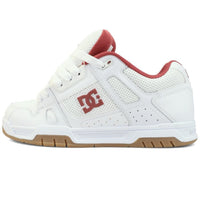 White DC Stag skate shoes with black accents, durable rubber sole, and classic skateboarding style from DC Shoes.