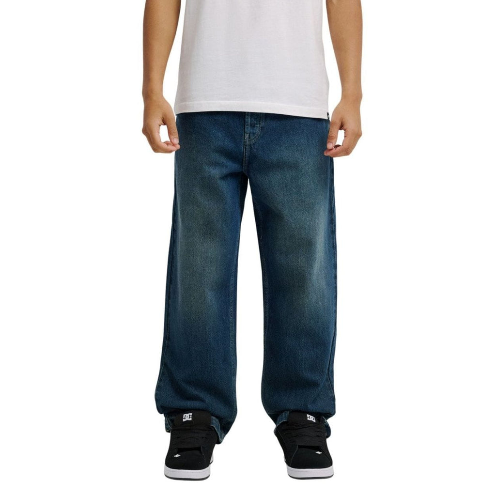 Blue DC Shoes Worker Baggy Double That Denim Jeans, relaxed fit with double-stitched details, displayed on a neutral background.