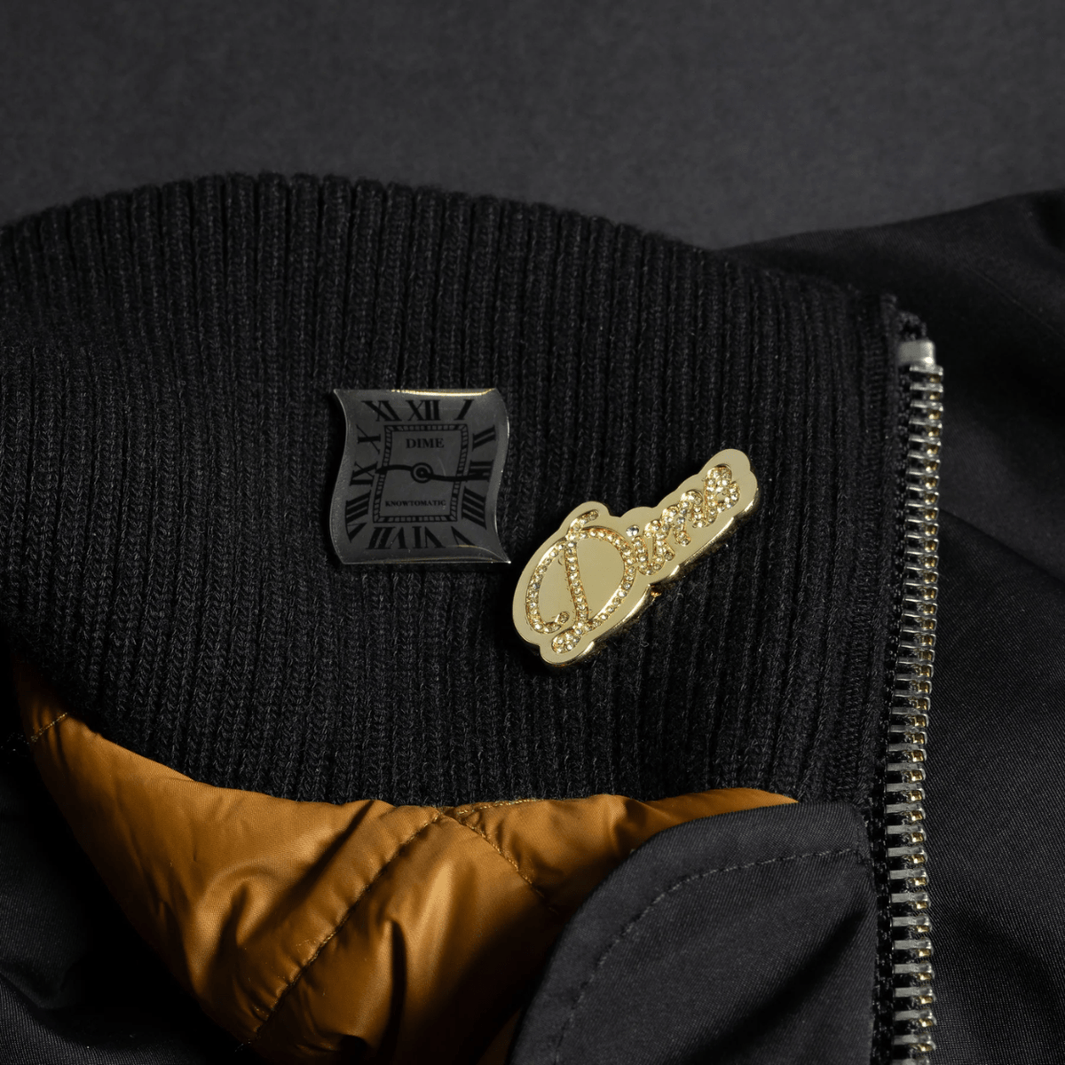 Dime MTL Pin Pack featuring gold and silver badges with Dime MTL branding and stylish designs on metal pins.