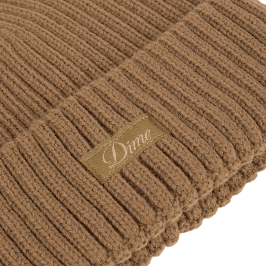 Dime MTL Cursive Fold Beanie in coffee color, stylish knit hat with embroidered logo, perfect for cold weather.