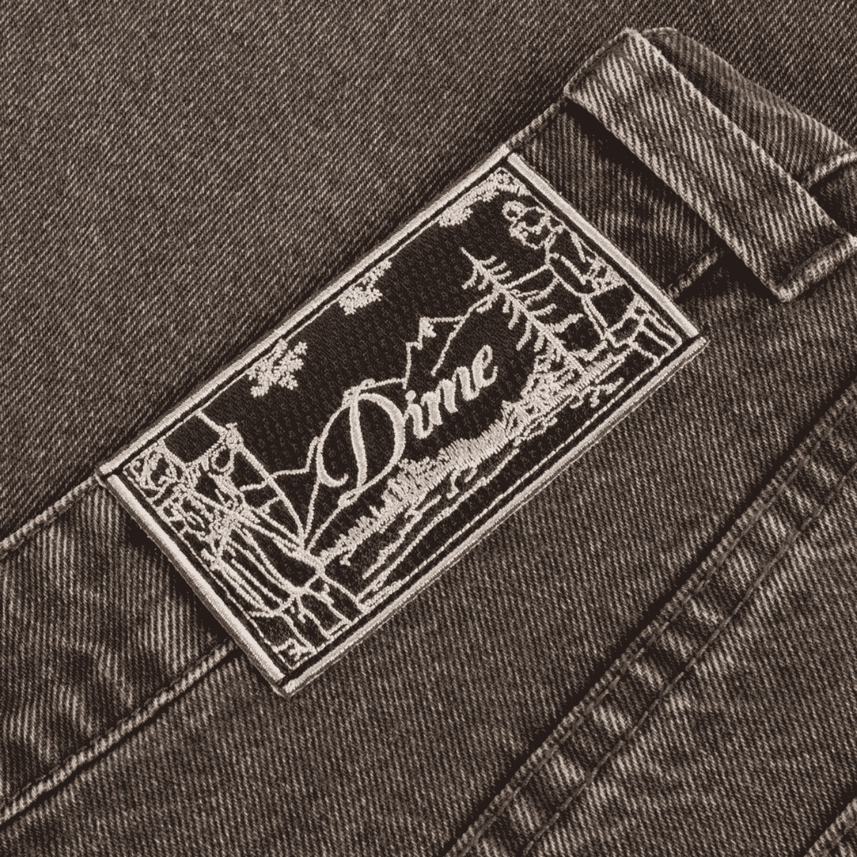 Dime MTL Baggy Denim Pants in Sandblasted Brown, featuring relaxed fit and distressed denim texture.