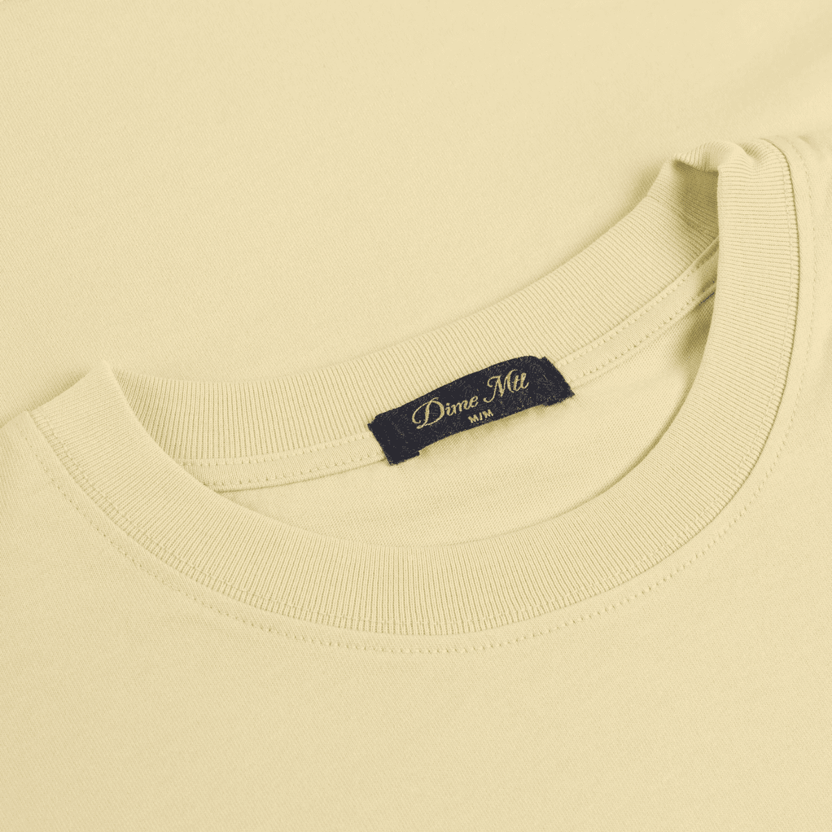 Cream Dime MTL Vortex T-Shirt featuring a bold vortex graphic on a casual cotton tee, designed by Dime MTL.