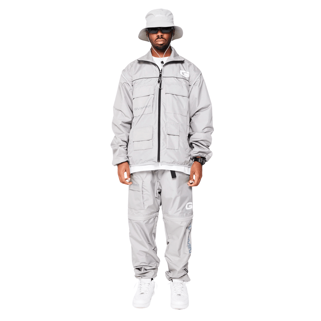Grey GVNMNT Clothing Co Hardwear Upper 2-in-1 jacket with layered design, lightweight fabric, and adjustable hood for versatile wear.