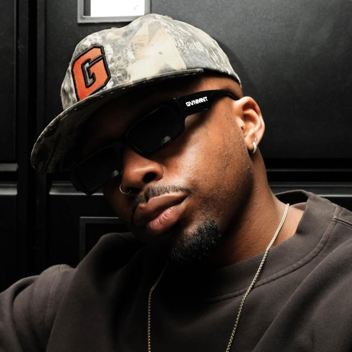 GVNMNT G Way cap in forest camo and orange, stylish cap from GVNMNT Clothing Co featuring a rugged design and adjustable fit.
