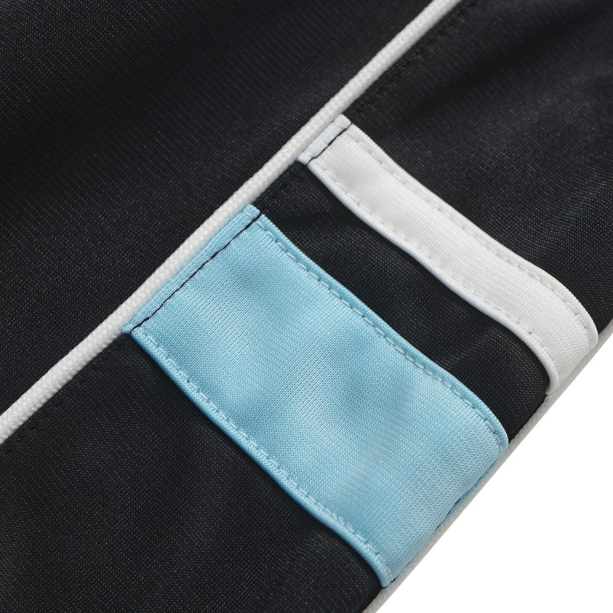 Black Helas Detente Tracksuit Bottoms with elastic waistband and side pockets, designed for comfort and casual style.