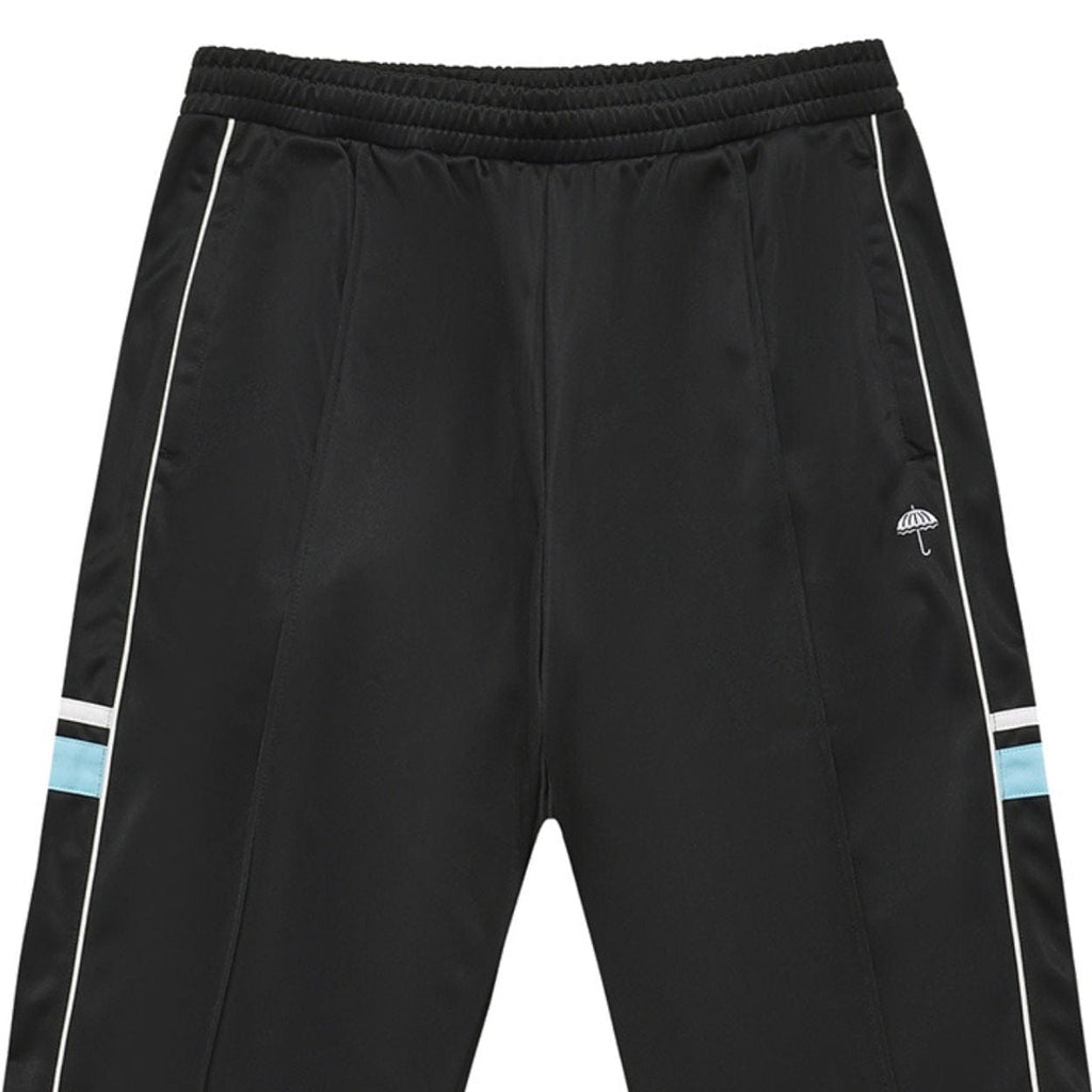Black Helas Detente Tracksuit Bottoms with elastic waistband and pockets, shown on a white background.
