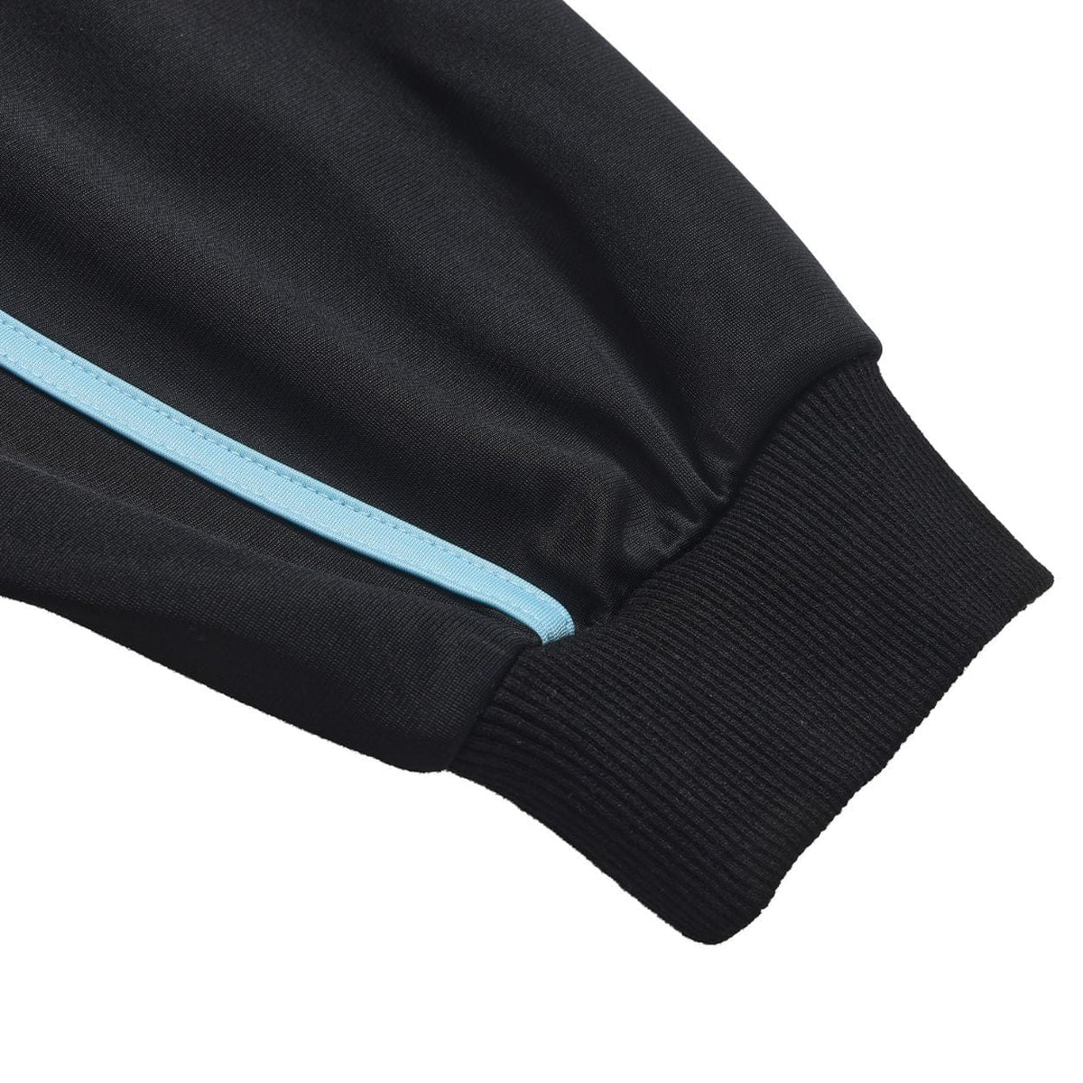 Black Helas Detente Tracksuit Jacket with zip-up front and sporty design, shown on a hanger.