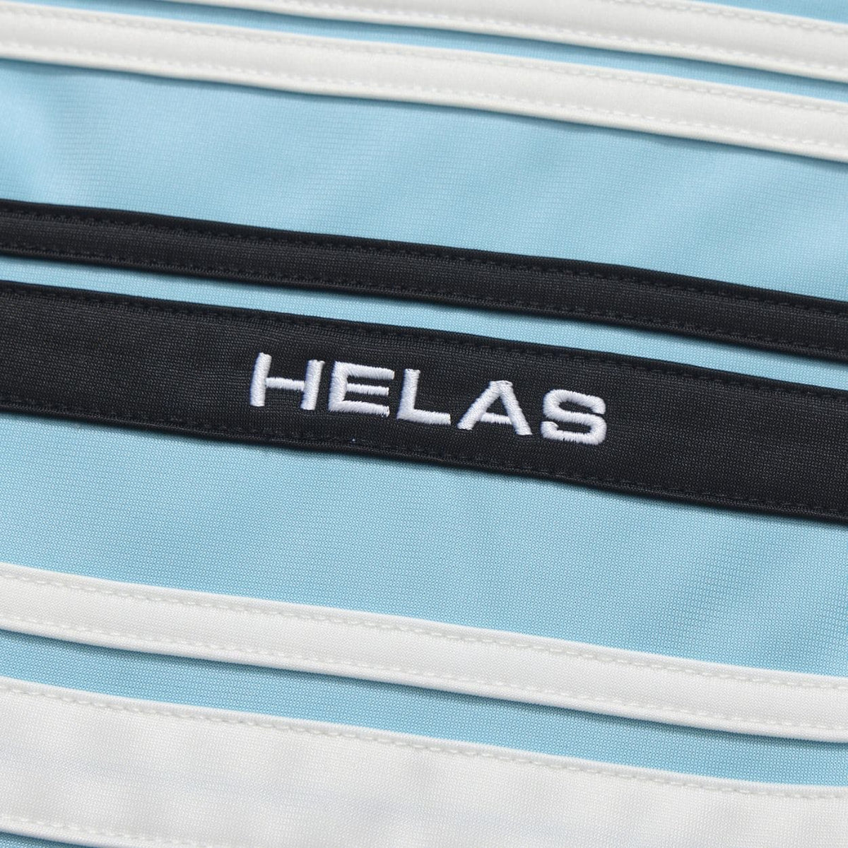 Black Helas Detente Tracksuit Jacket with zip closure and sporty design, shown on a model.