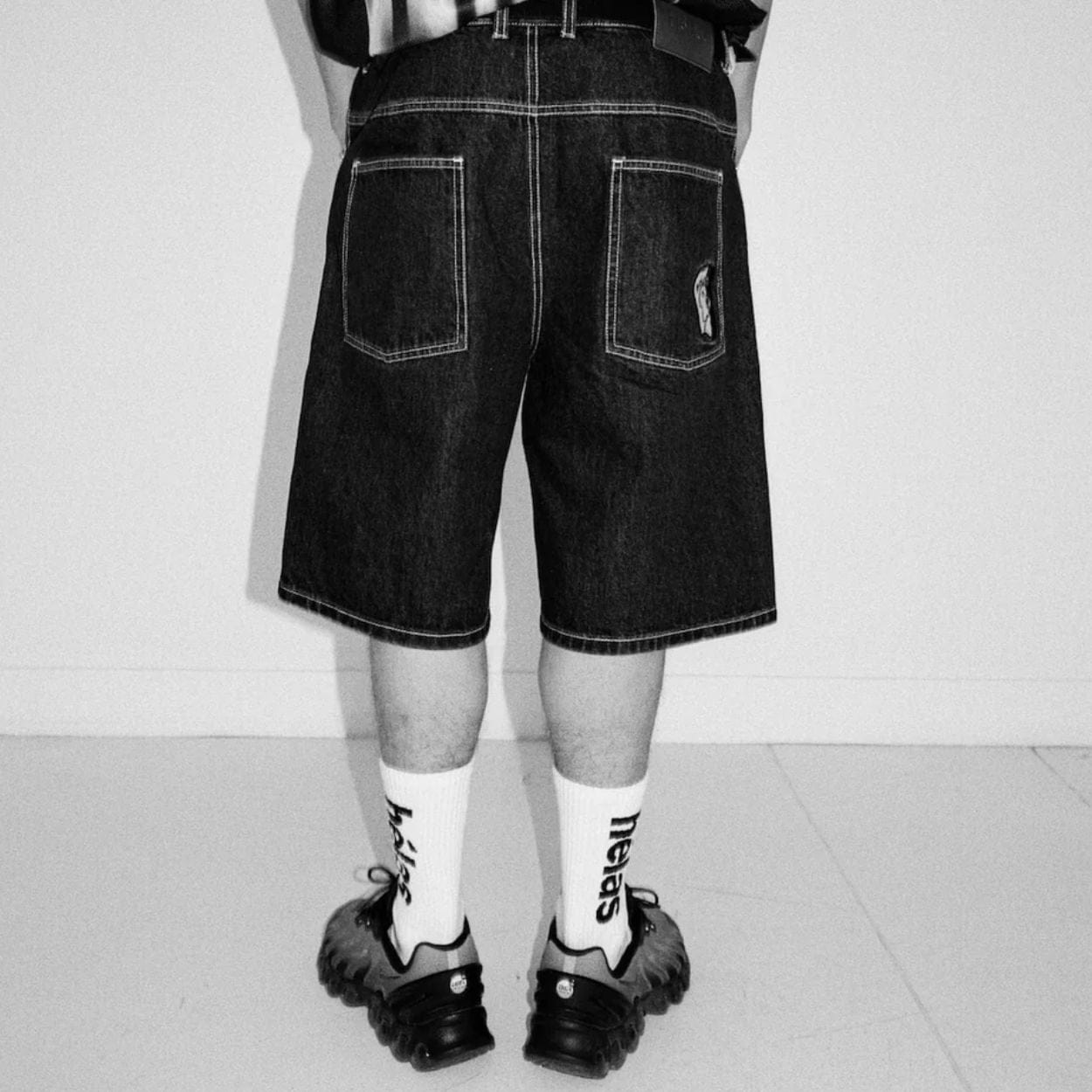 Helas Dieu Grec Jean Shorts in washed black denim, featuring distressed details and casual fit, perfect for streetwear style.