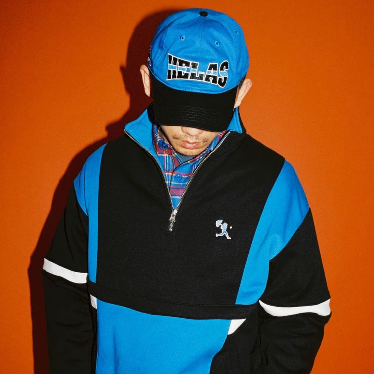 Blue and black Helas Hoop Cap featuring a classic design, made from durable fabric with a curved brim and adjustable strap.