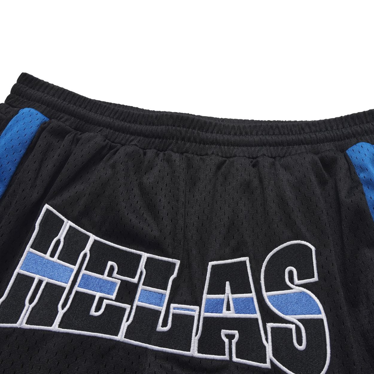 Black Helas Hoop Sport Shorts laid flat, showcasing their lightweight fabric and sporty design for active wear.