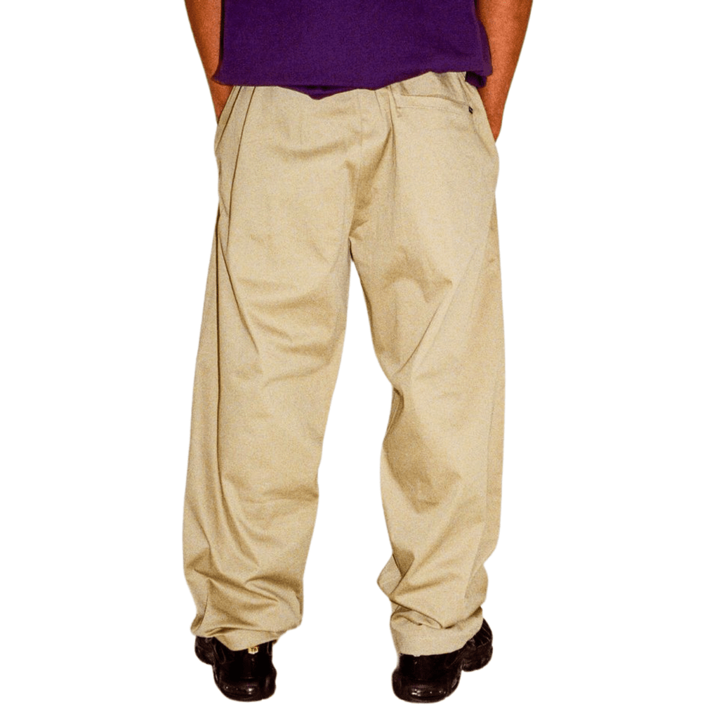 Beige Helas Surfer Pants jeans featuring a relaxed fit and casual style, shown laid flat with front pockets and stitching details.