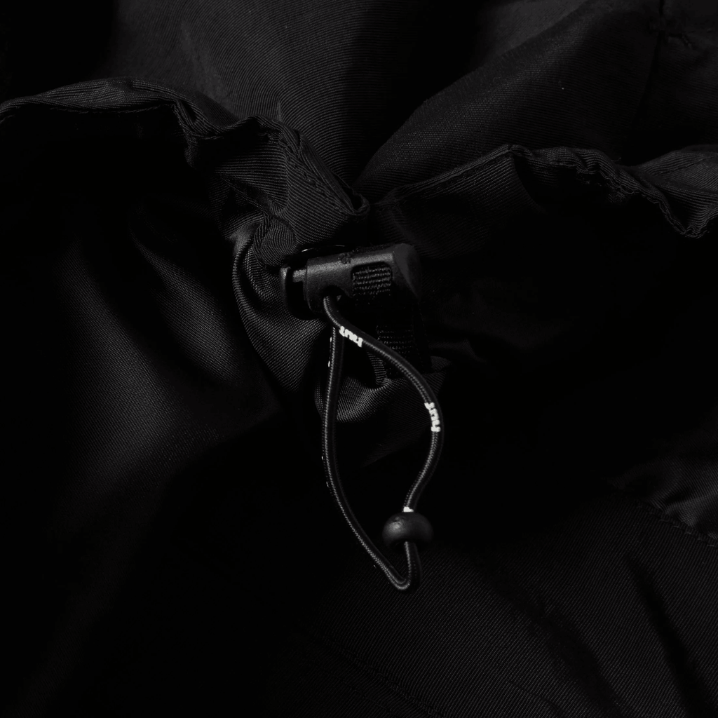 HUF All Caps Shell Jacket in black, lightweight waterproof jacket with hood and zippered pockets, stylish outerwear for men.