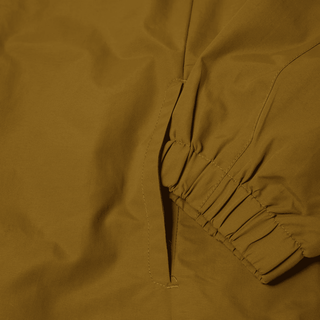 HUF All Caps Shell Jacket in rich brown, lightweight water-resistant jacket with hood and full front zipper.