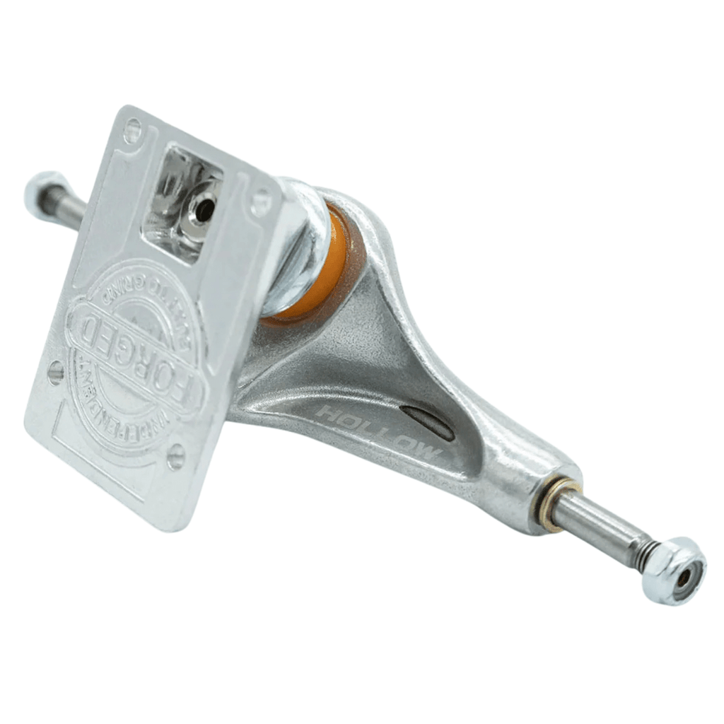 Silver Independent Hollow Forged Stage 11 skateboard trucks mounted on a deck, showcasing durable construction and sleek design.