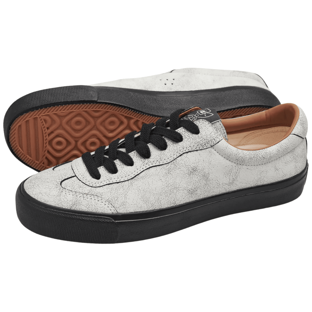 Last Resort AB Milic Suede Lo Skate Shoes in artisan white and black, featuring a sleek design and skate shoe style.