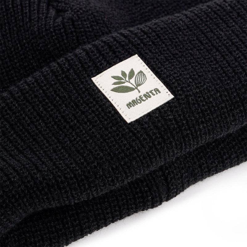 Magenta Skateboards Fam beanie in black, soft knit fabric with a folded brim, featuring the Magenta logo for skateboarding style.