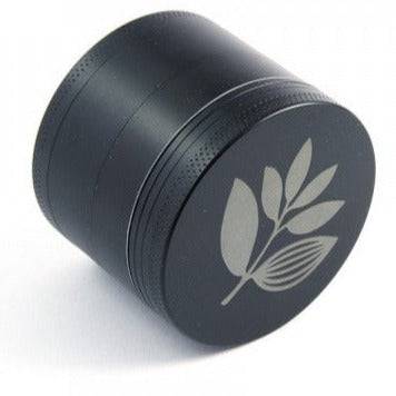 Magenta Skateboards grinder in black, showing the compact metal tool with Magenta branding for skateboard grinding and maintenance.
